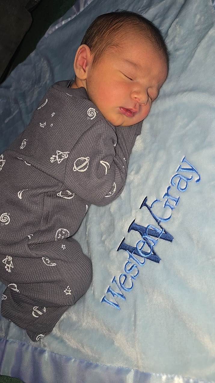 Westen sleeping on his personalized blanket